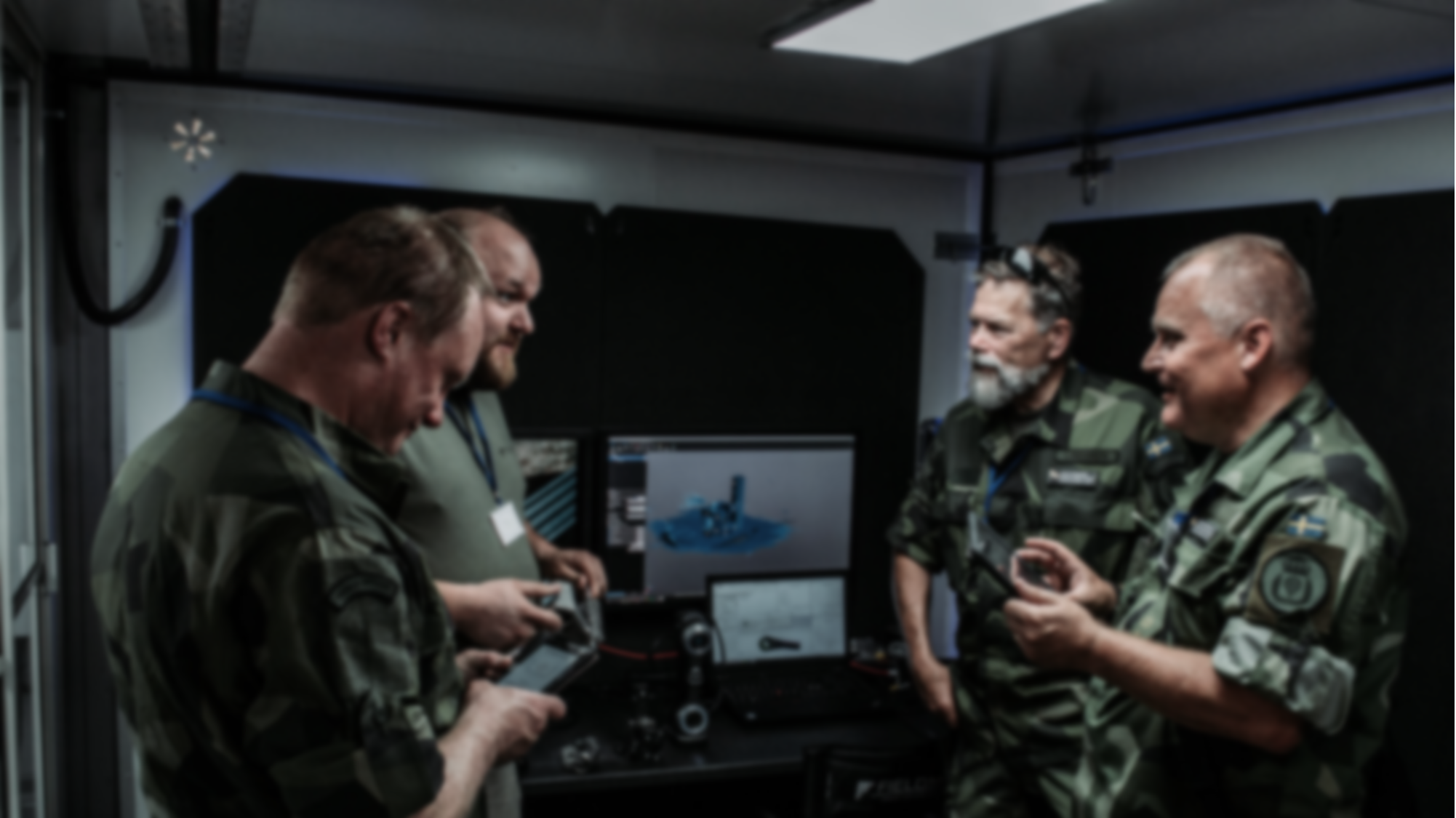 Military personnel inside NOMAD container